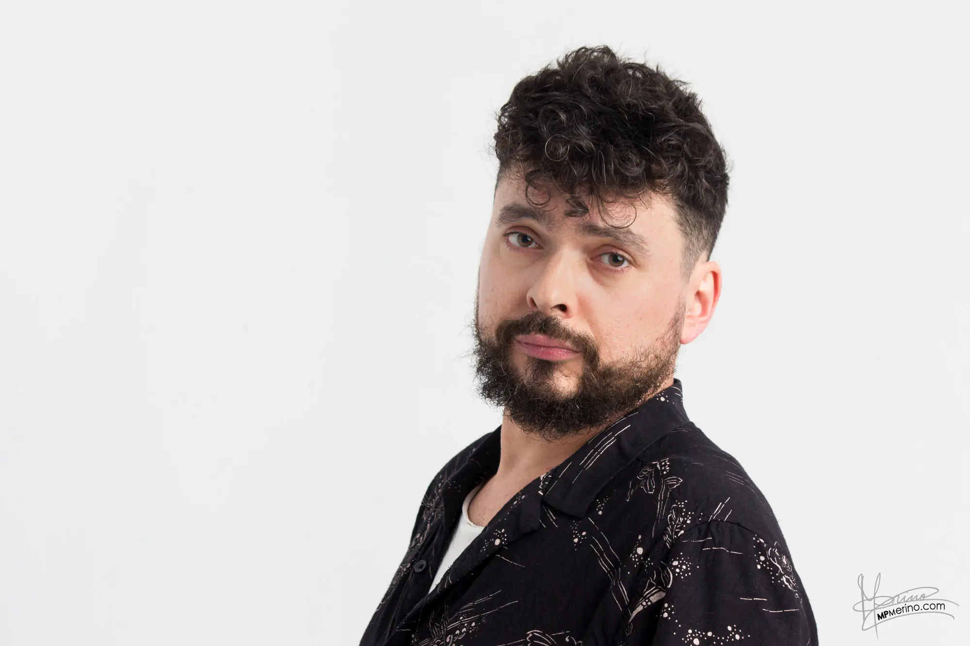 Studio portrait of a boy looking nonchalantly at the camera
