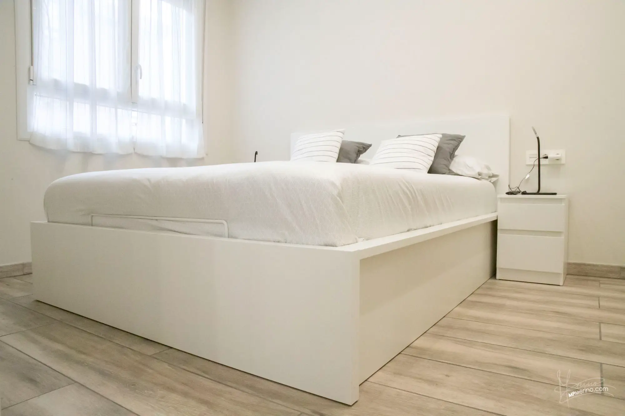 Interior photograph of the bedroom of a holiday flat