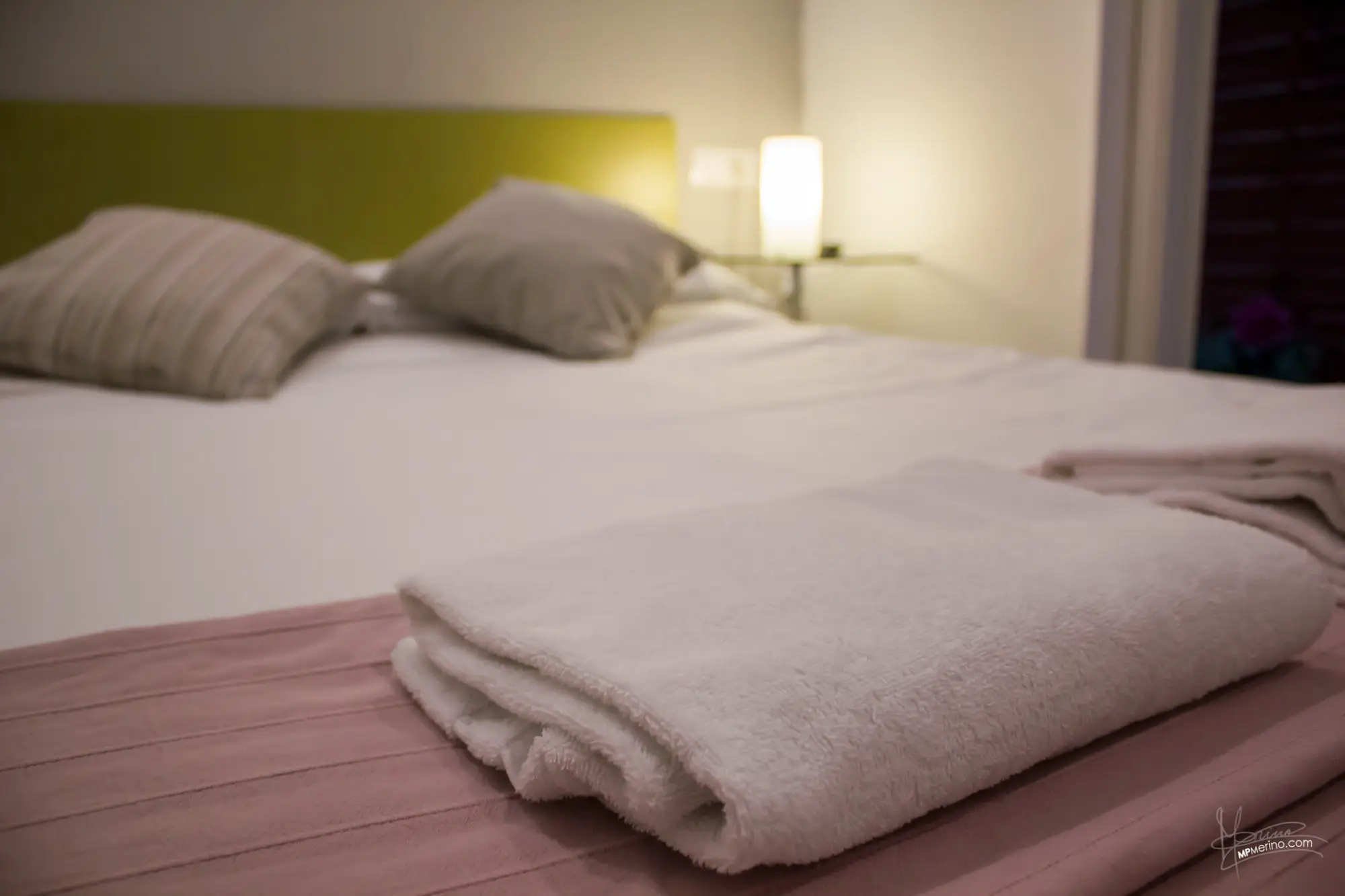 Interior photograph of a hotel bed