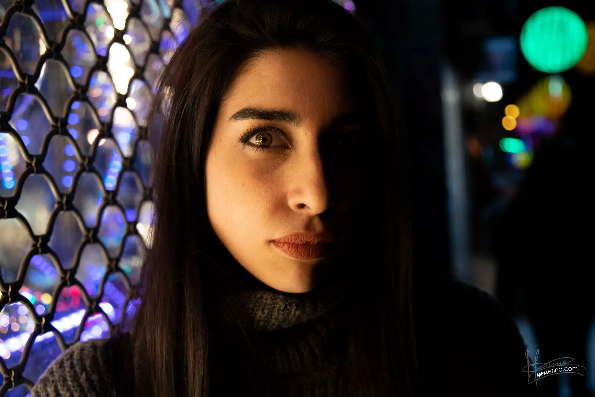 Portrait of a girl with a strong play of light at night