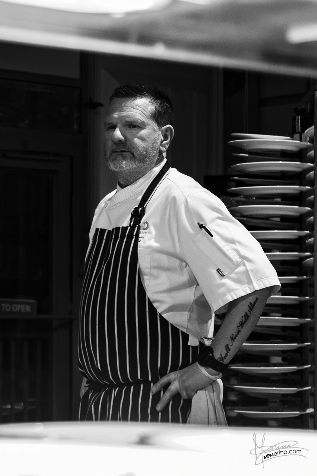 Black and white photograph of a cook looking at infinity