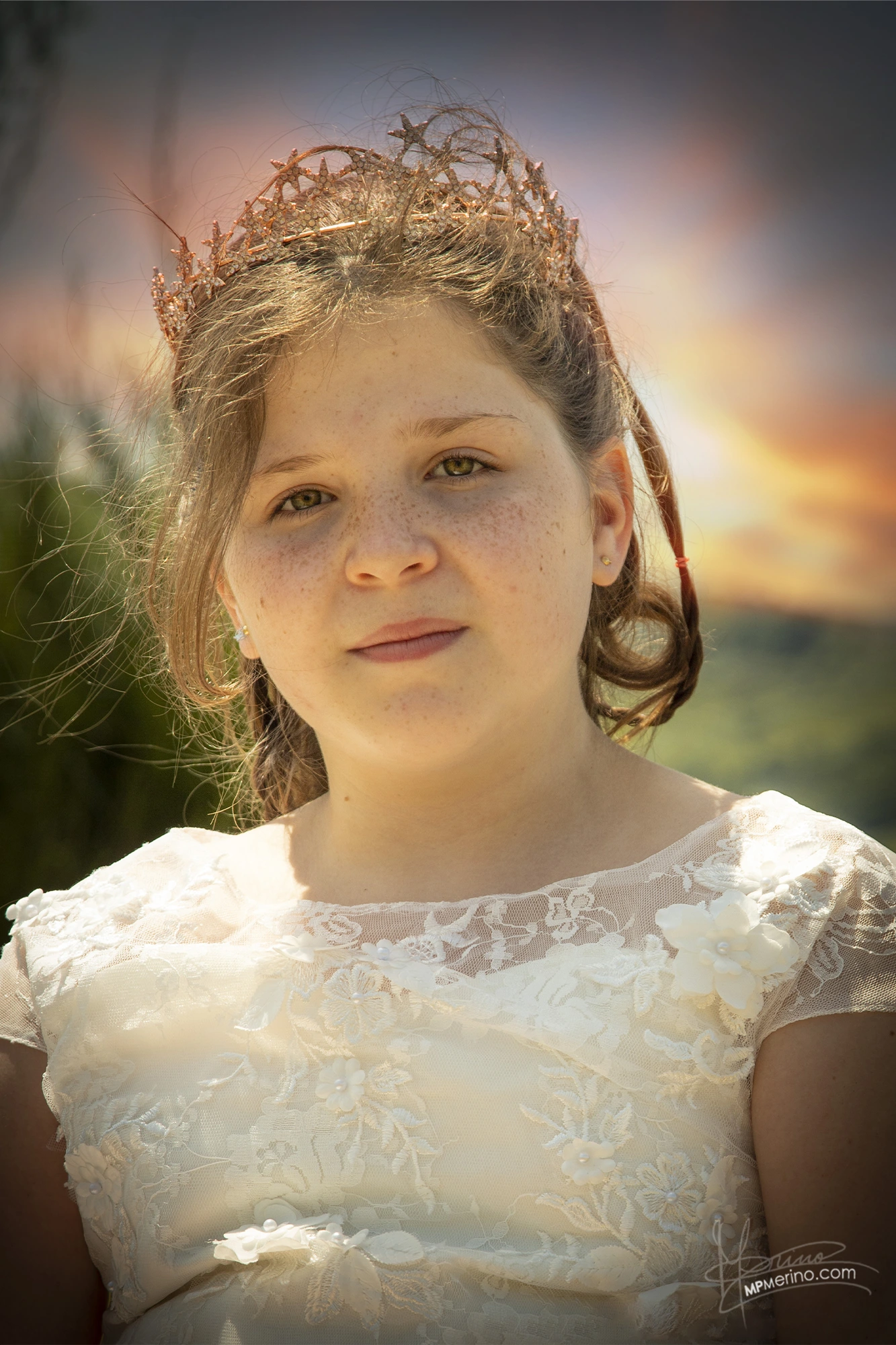 Portrait of a girl looking at the camera in communion dress