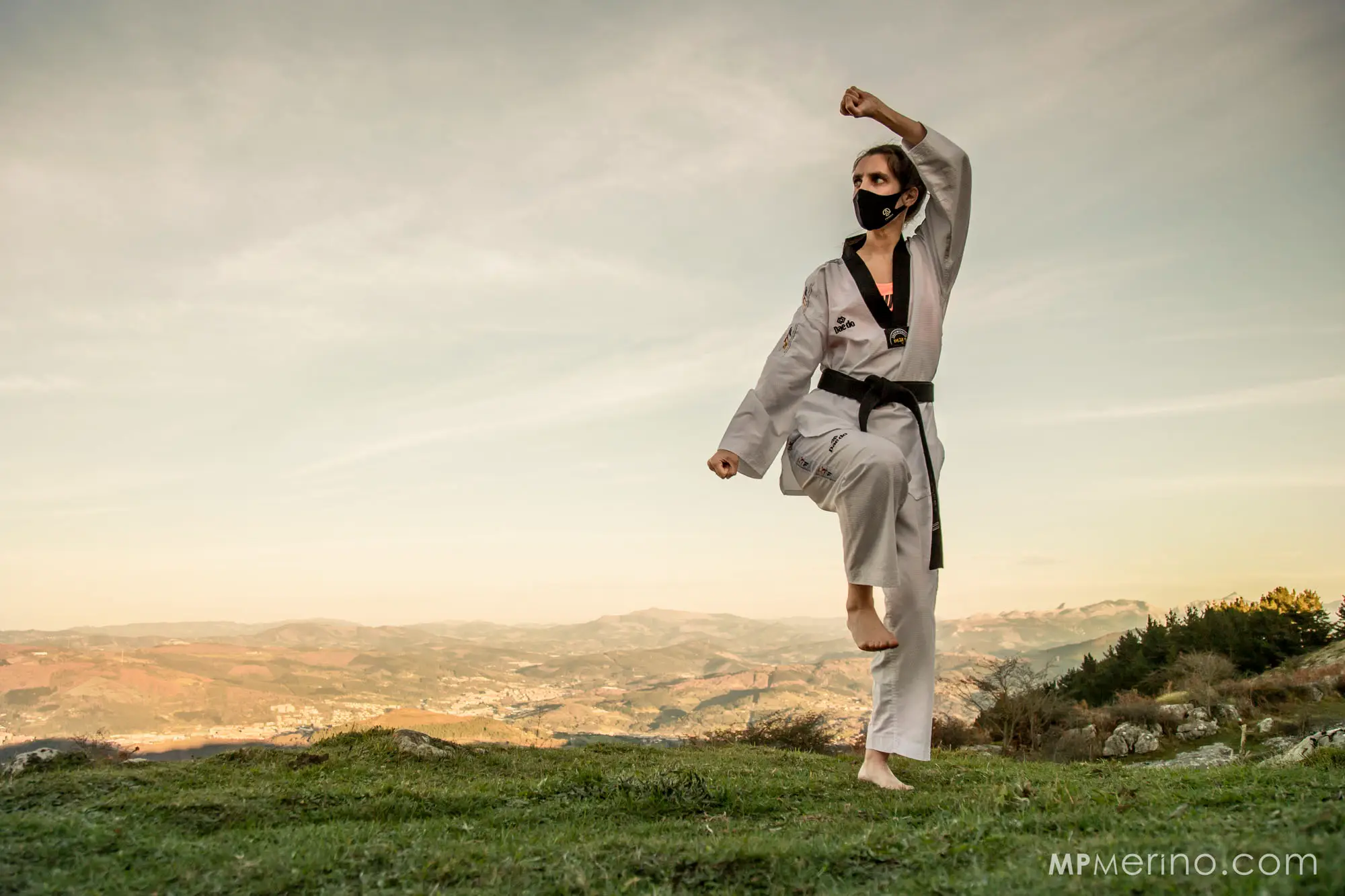 Photograph of a Taekwondo trainer performing a defence, at the top of the Pagasarri mountain in Bilbao